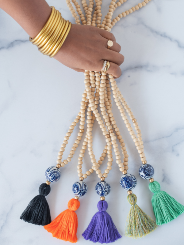 A flatlay of colorful beaded necklaces