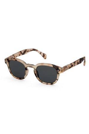 One pair of flora sunglasses in light tortoise with white background