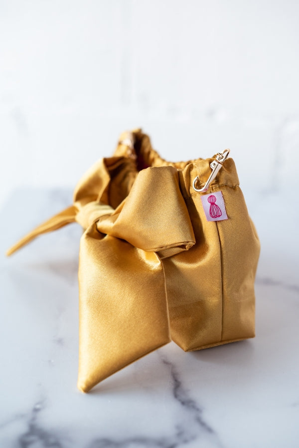 The Mimi Clutch in Gold