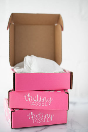 A tassel mystery box in pink 