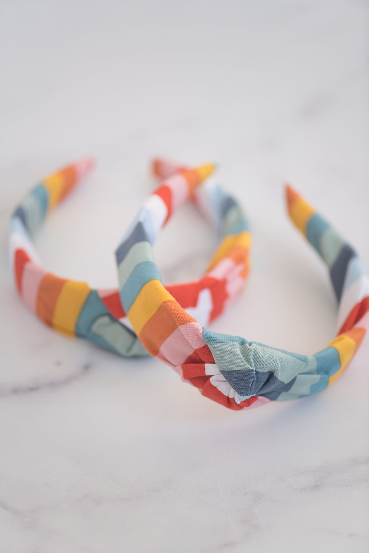 The Tiny Tassel Headband in Rainbow Striped Blues - TheTinyTassel