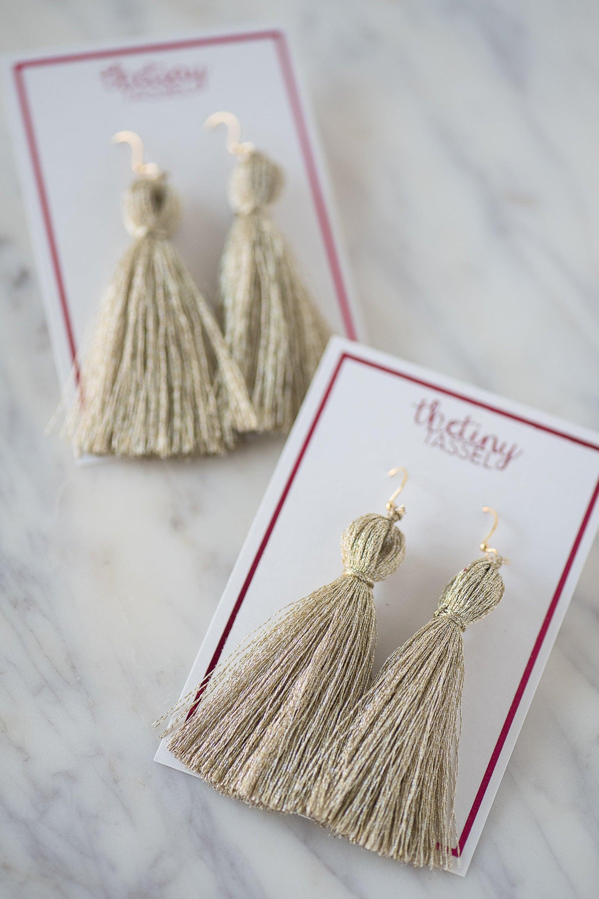 The St. Margaret Tassel Earring in Platinum - TheTinyTassel