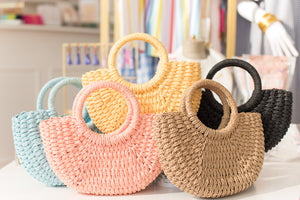 collection of woven bags in different color variety
