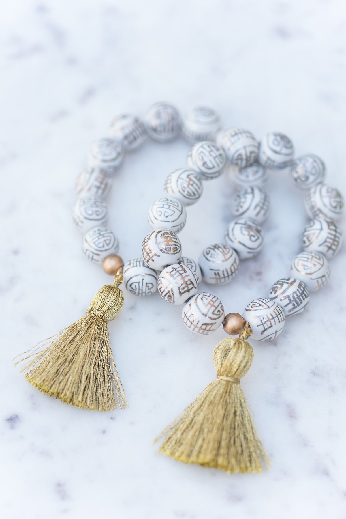 The Poinsett Tassel Bracelet in Metallic Gold - TheTinyTassel