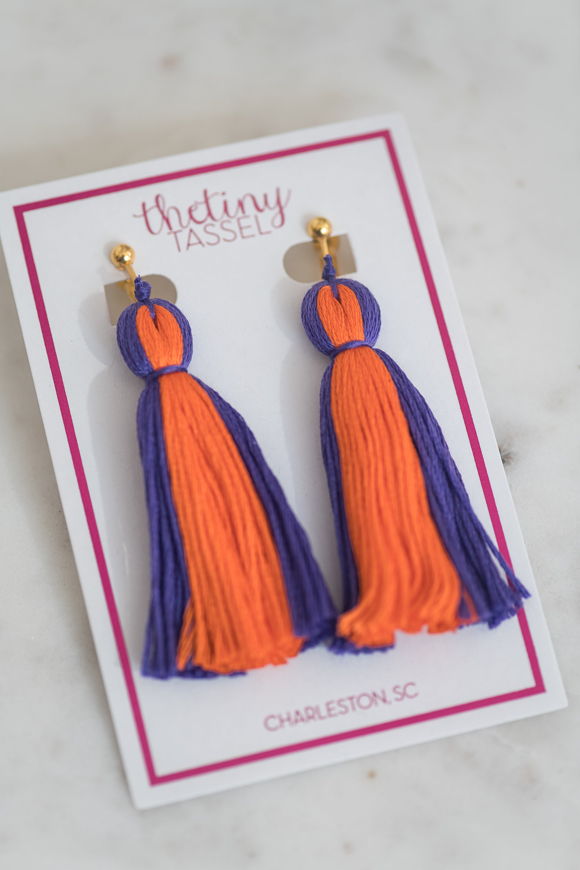 The Lilly Clip-On Tassel Earring in Dark Purple & Orange
