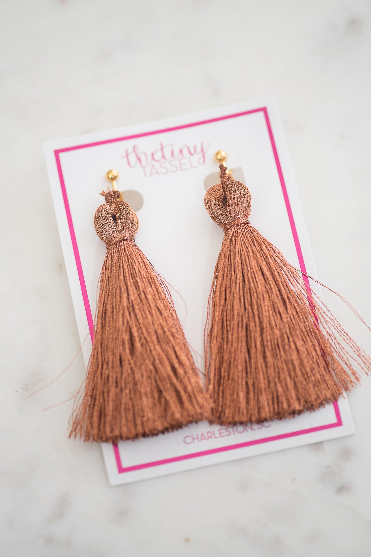 The St. Margaret Clip-On Tassel Earring in Copper - TheTinyTassel