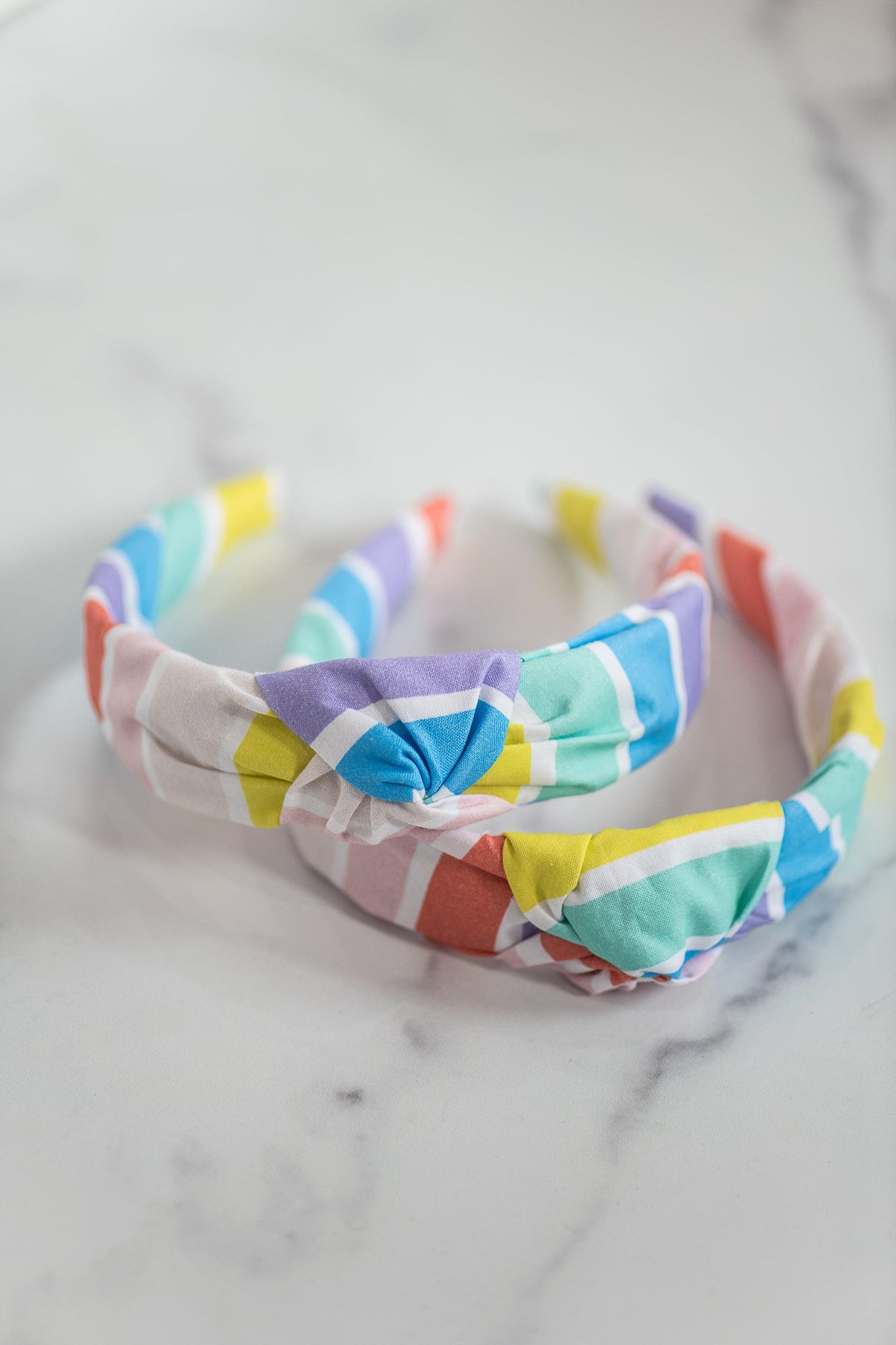 The Tiny Tassel Headband in Rainbow Striped Brights - TheTinyTassel