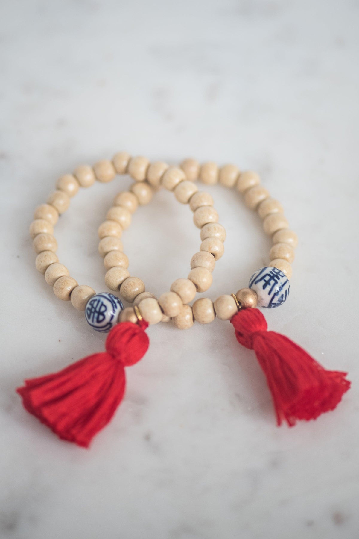 The Elliotborough Tassel Bracelet In Red - TheTinyTassel