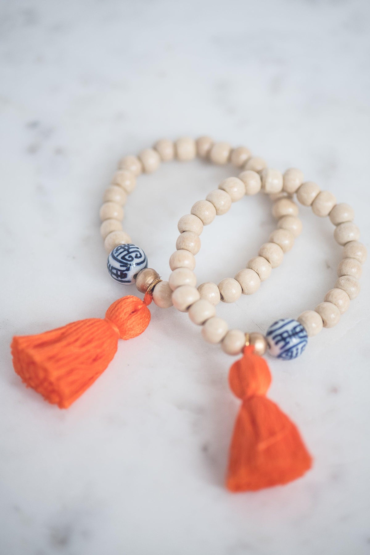 The Elliotborough Tassel Bracelet In Orange - TheTinyTassel